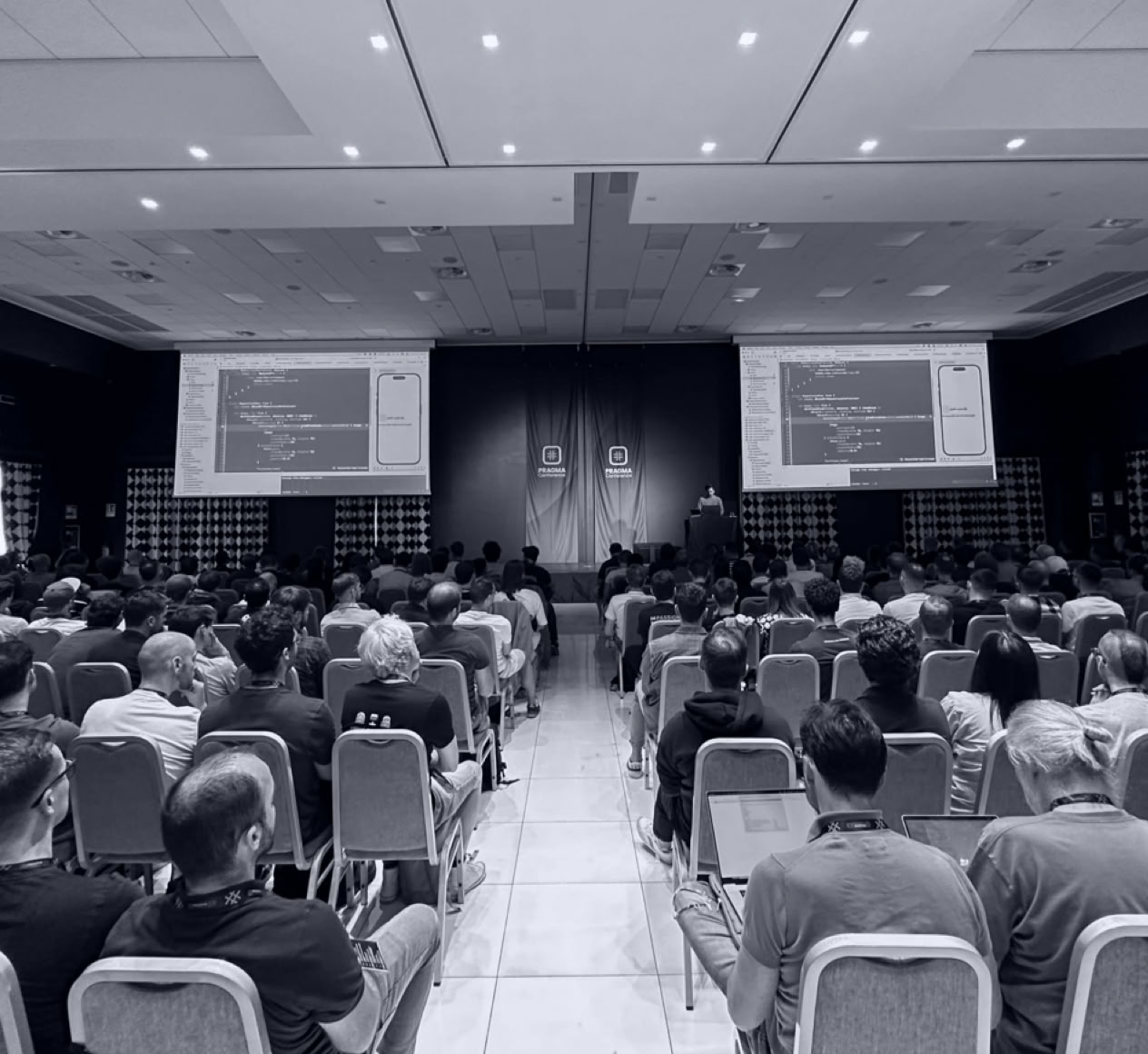 Man Taking Photo of Brown Decorative Speaker